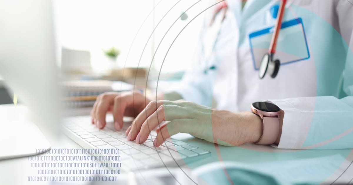Doctor typing on computer