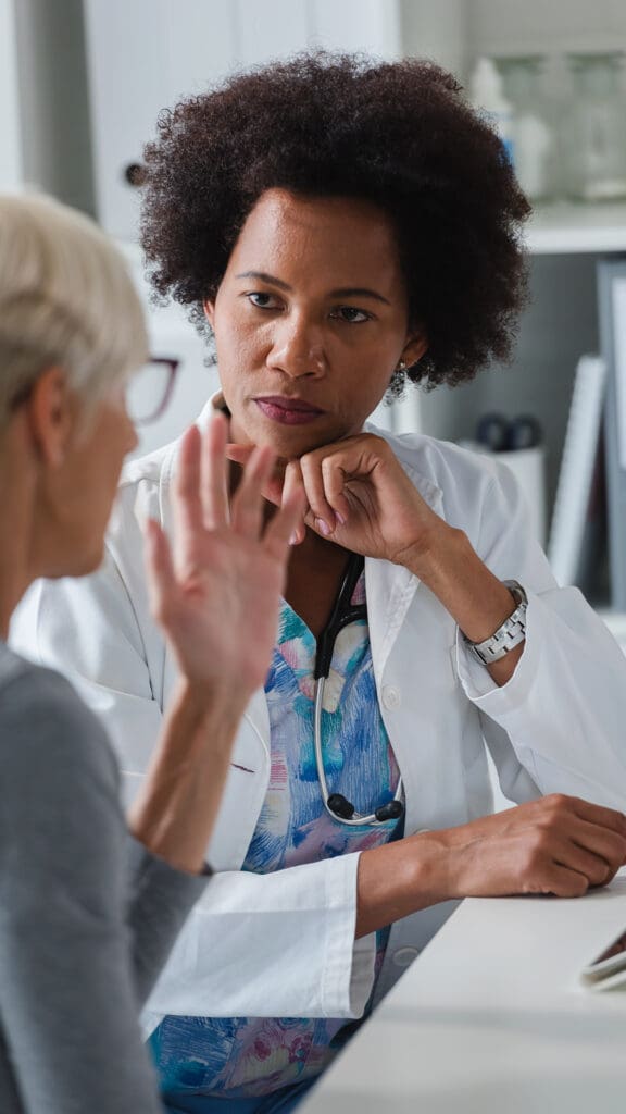 Doctor speaking to patient about EvokeConnect
